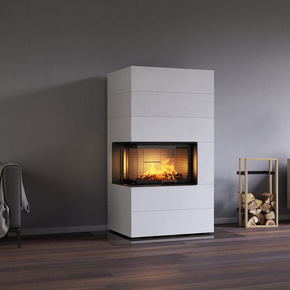 Holz-Kamin VISIO 2 ELEMENT eingebaut in weiss gestrichenen Betonelementen neben Sofa und Sideboard