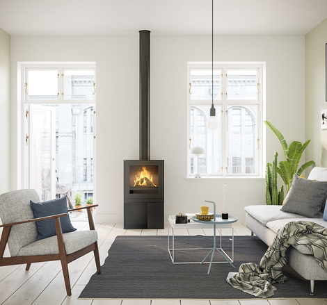 Gas-Kaminofen Q-TEE 2 mit Stahltür und praktischem Sockel in stylischer Wohnung mitten in der Stadt