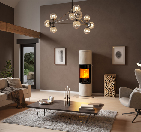 Holz-Kaminofen JUNO 166 L in Naturstein "Porto" und Vollglas-Feuerraumtür in grossem Wohnzimmer in Erdfarben