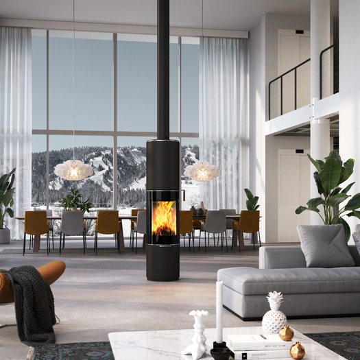 Holz-Kaminofen PILAR in Schwarz mit Vollglas-Feuerraumtür als drehbarer, runder Kaminofen mitten in einem riesigen Wohnraum