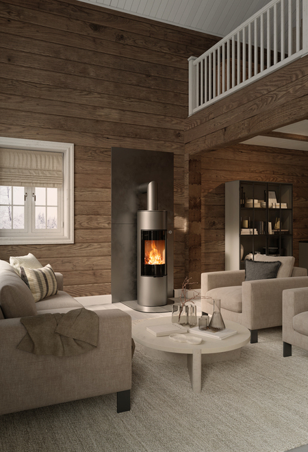 Holz-Kaminofen VIVA 140 L in der Farbe Platin mit Vollglas-Feuerraumtüre an Holzwand im rustikalen Wohnhaus