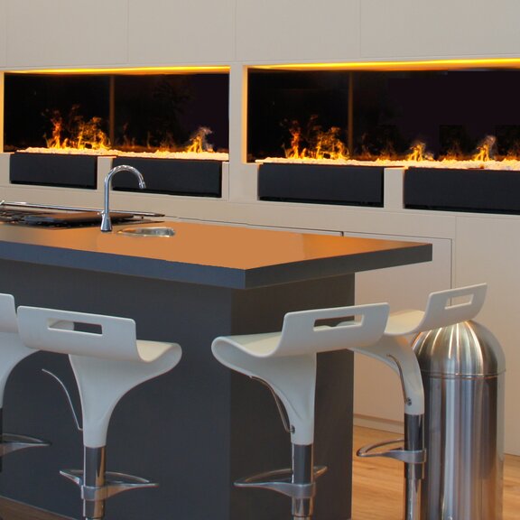 Elektrofeuer Cassette L Pebbles mit Kieselsteindekoration in der Küche eingebaut